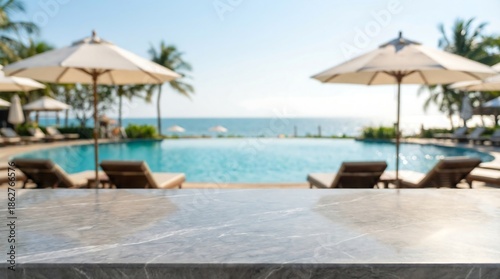 Wallpaper Mural a tranquil poolside view showcases inviting lounge chairs elegant umbrellas and a sparkling blue infinity pool overlooking the calming ocean horizon high quality Torontodigital.ca