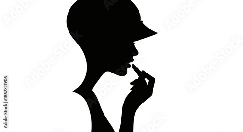 Elegant silhouette of a woman applying lipstick, capturing beauty and sophistication within a