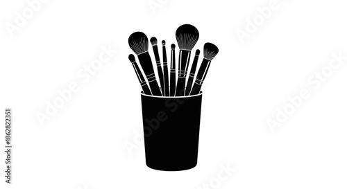Elegant silhouette of makeup brushes in a container, perfect for beauty and cosmetics concepts
