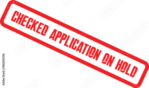 A checked application form with a red stamp mark reading on hold sits on a desk.