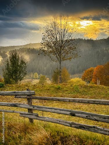 Sunny Autumn Carpathians with Puffy White During The Sunset
