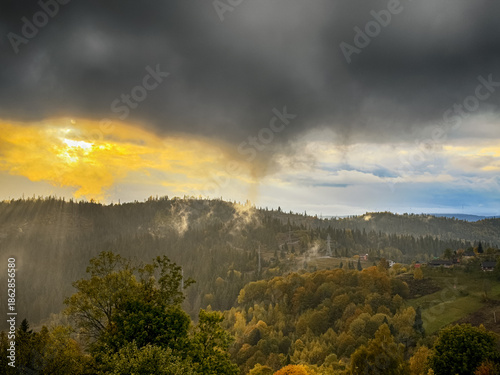 Sunny Autumn Carpathians with Puffy White During The Sunset