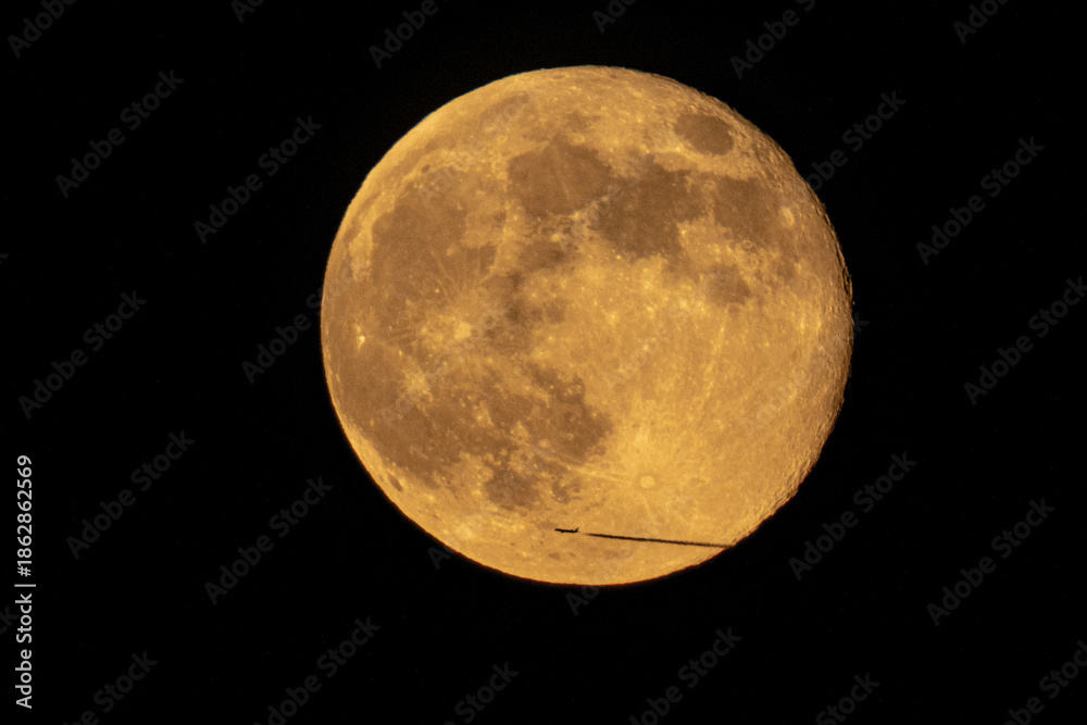 Fototapeta premium moon and pane in the night sky