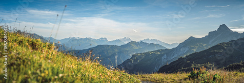 Panoramic alpine view from near Freiburger Hütte and Formarinsee looking south over the Klostertal valley toward the Montafon region, surrounded by rugged peaks of the Austrian Alps.