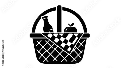 Black picnic basket with bottle and apple on checkered cloth