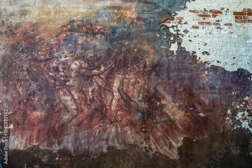 фотографія A badly damaged church fresco depicting a scene of hellfire
