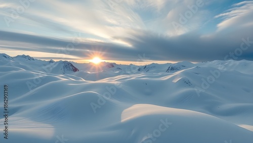 Majestic Snow Covered Mountains at Sunset. Beautiful Winter Landscape with Cloudy Sky