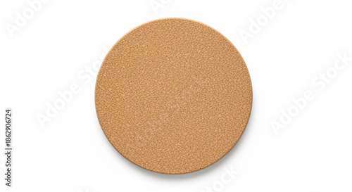 A round cork coaster on a plain white background