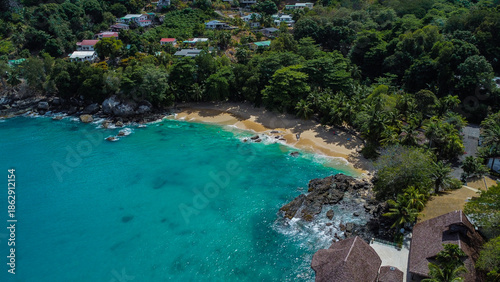 Tropical Sandy Beach and Turquoise Ocean Water with Coastal Villas