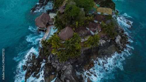 Turbulent Water and Dark Rocks: Overcast Atmosphere on a Tropical Coastline
