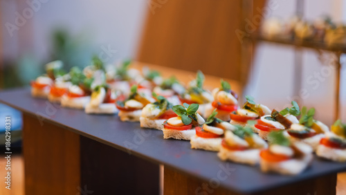 Photos Luxury appetizer platter with crostini cream cheese and fresh tomato topping