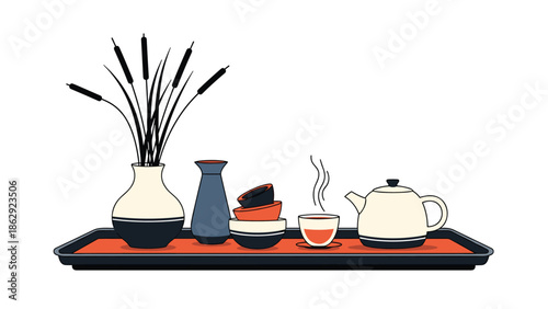 Traditional Japanese tea set including a teapot cups and a decorative vase with pampas grass arranged on a black serving tray.