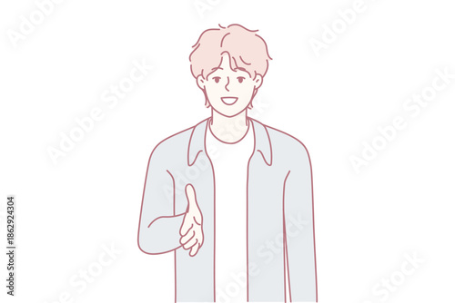 Youthful individual offering welcoming handshake smile, Bright young man presenting open hand for friendly greeting, Energetic young adult with amiable expression extending handshake for introductions