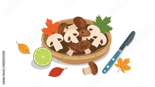 Freshly picked brown and white mushrooms arranged in a traditional woven basket with autumn leaves, a lime slice, and a kitchen knife on white background.