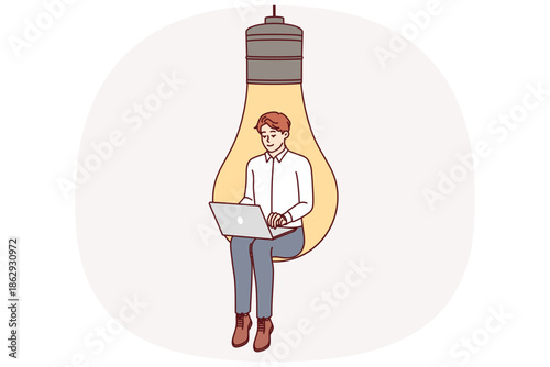 Man inventor with laptop sits in large light bulb, symbolizing inspiration for coming up with business ideas. Smart guy inventor develops web service or software for internet users