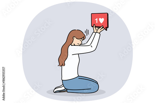Woman blogger holds like icon, kneeling and dreaming of receiving lot of feedback from subscribers on social networks. Girl blogger suffering digital addiction needs constant approval followers