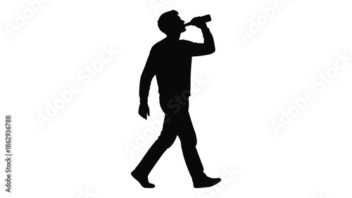 Silhouette of a man drinking from a bottle while walking forward