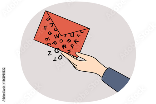 Envelope with letter in hand of person sending epistle with letters falling out, as symbol of postal delivery of messages. Concept of exchanging email messages for quickly transmitting information