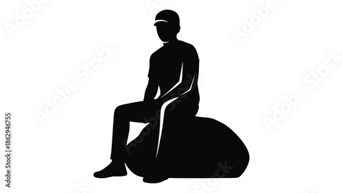 A silhouette of a person seated on a beanbag chair simple design