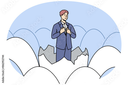 Businessman stands in eggshell as metaphor for emergence of new professional thanks to business education. Ambitious businessman, feels confident in own abilities to obtain managerial position
