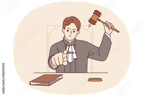 Stern judge pronounces verdict and points finger at screen after hitting gavel and announcing prison term. Angry judge sits at table demonstrating inflexibility and desire to punish criminal