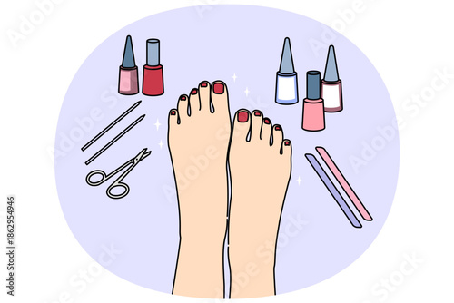 Woman feet after pedicure procedure, with nail polish and scissors or files near well-groomed painted nails. Pedicure services for ladies, making toes more attractive, for wearing open shoes