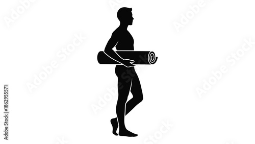 Silhouette of a man carrying a rolled yoga mat in profile