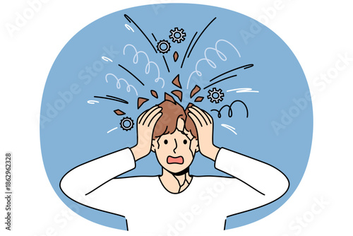 Psychological unbalanced man feels head explode due to excessive worries caused by stress. Overload of thoughts and mental pressure became reason for psychological breakdown or panic attack