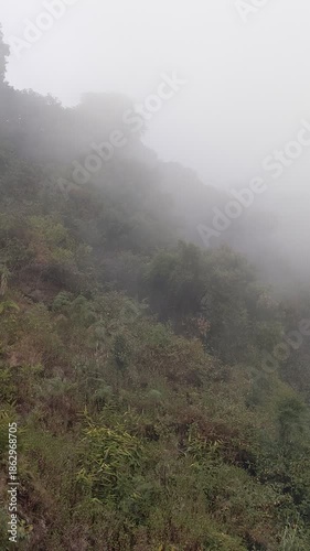 Foggy morning hills mountain view weather change environment.