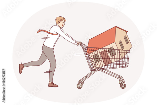 Man realtor or real estate agent runs pushing house inside supermarket cart as metaphor for property investment. Realtor guy is in hurry to make deal to buy or sell cottage to generate income