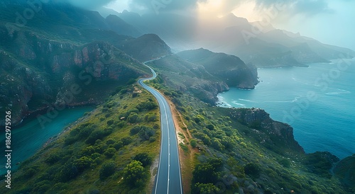 Coastal road winding along rugged cliffs and ocean Photo