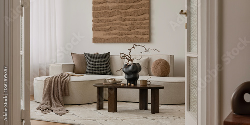 Quadro su tela Earthy modern interior with round sofa, minimal coffee table, and large textured wall art in a soft natural palette