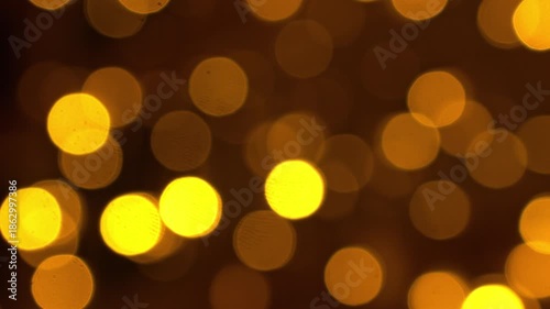 Abstract blurred golden light circles form a bright shimmering texture, ideal for luxury themes, New Year celebrations, digital wallpapers and stylish advertising layouts.