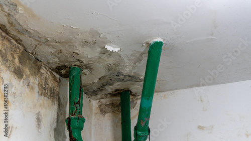 Fotografie old broken cast iron sewer risers and pipes in the dormitory