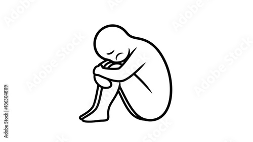 Sad person sitting alone with head down