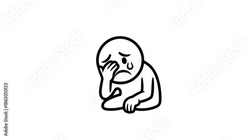 Sad person sitting alone with hand on face