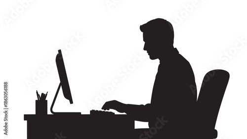 Man Working on Computer in Office Silhouette