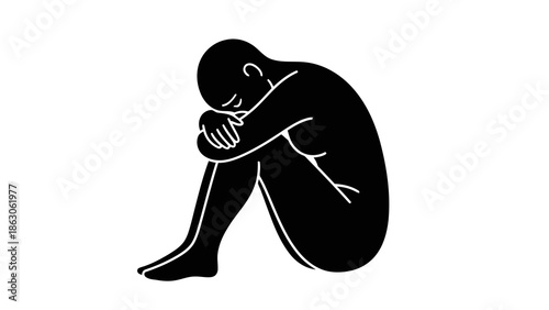 Man sitting on floor with head in hands