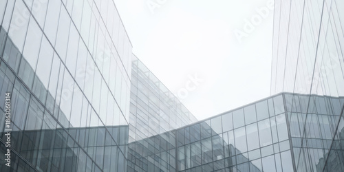 Modern glass wall background with sleek business tower showing innovation in architecture line and futuristic high rise building design under bright sky