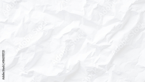 A close up view of intensely crumpled white paper displaying a textured and abstract background pattern