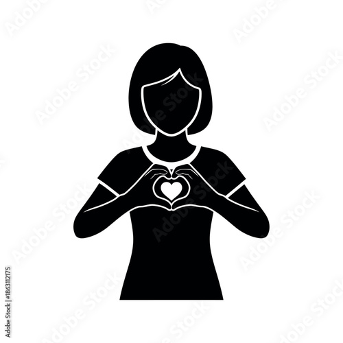 Woman making heart shape with hands.