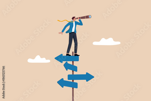 Businessman stands on a crossroads of arrows, looking through a telescope for future direction