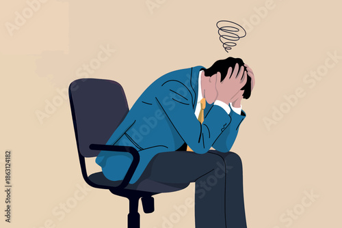 A frustrated businessman sitting on an office chair holding his head in distress