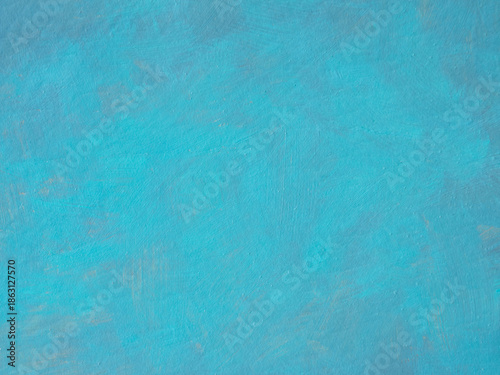 Turquoise background. Priming a concrete wall before painting. Plastering an old brick painted wall. Studying paint layers before restoration