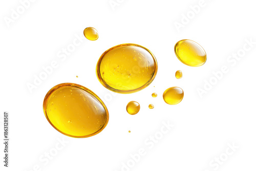 Oil droplets float on a white background showing different sizes and shapes of drops during a creative display of liquid