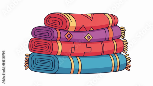 Stacked colorful rolled blankets with fringed ends