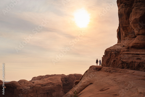 a couple walking by canyon 