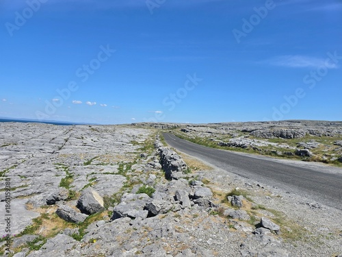Φωτογραφία Winding road through the ancient limestone karst landscape of The Burren in Coun