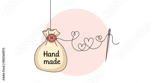 Small cloth bag labeled handmade with a needle and thread forming heart shapes illustrates the care put into artisanal craft projects.