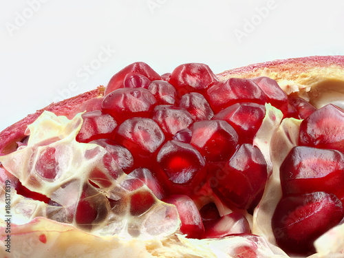 Close-up view of ripe pomegranate seeds showcasing their vibrant color and texture during a kitchen preparation